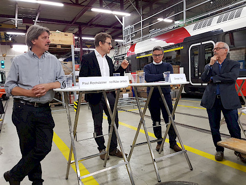 100 Jahre SEV im Depot der Frauenfeld-Wil-Bahn in Wil am 29. Oktober 2019: Podium mit Paul Rechsteiner, Daniel M&uuml;ller-Jentsch und Giorgio Tuti, moderiert durch Peter Hartmann.